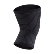 Black knee brace on a light gray background