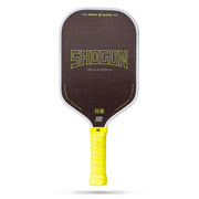 Shogun pickleball paddle with yellow handle on a white background