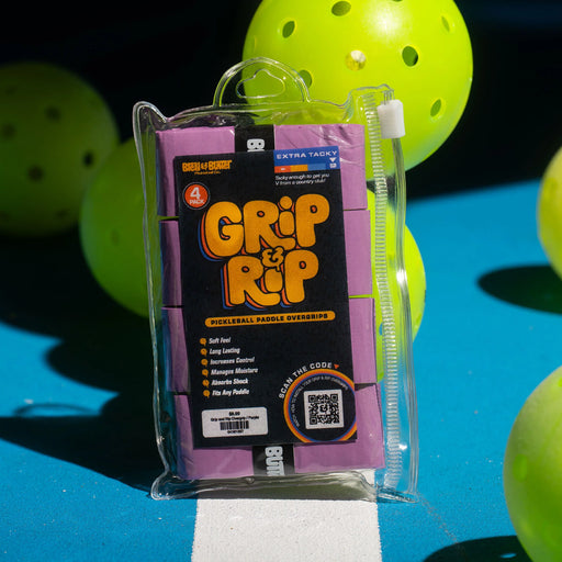 Packaged Grip Rip pickleball paddle overgrip with pickleballs in the background
