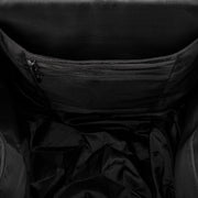 Close-up of a black jacket with a zipper detail on a dark background