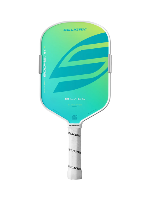 A Selkirk Boomstik LABS pickleball paddle featuring a vibrant green and blue gradient face, a white frame, and a white wrapped handle on a solid white background.