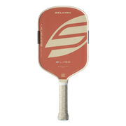 A Selkirk Bodystik pickleball paddle with a terracotta red face, cream-colored graphic accents, and a textured light gray grip, shown against a plain white background.