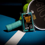 Grip and Rip pickleball paddle grip on a paddle with a blue background