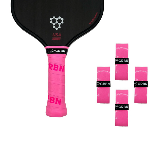Pink pickleball paddle with black grip and USA Pickleball logo, accompanied by pink wristbands with CRBN branding.