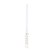White candle with black dots on a white background