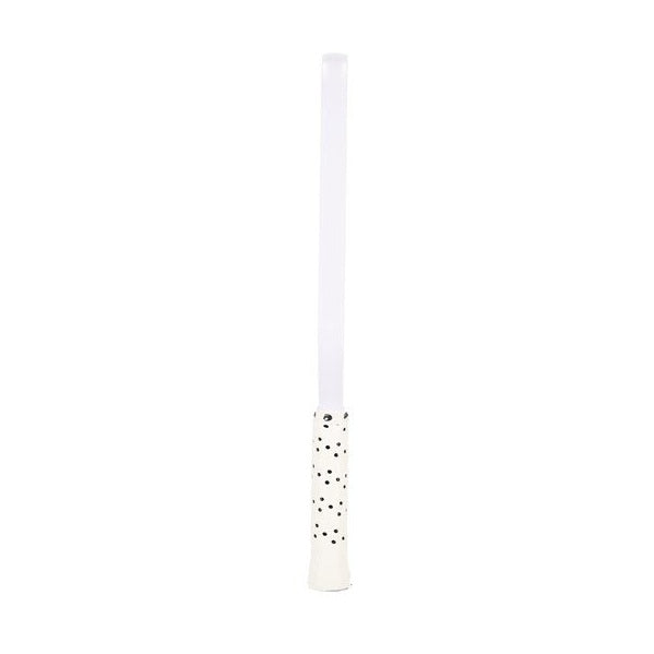 White candle with black dots on a white background