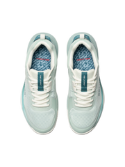Pair of light blue sneakers with white laces on a white background
