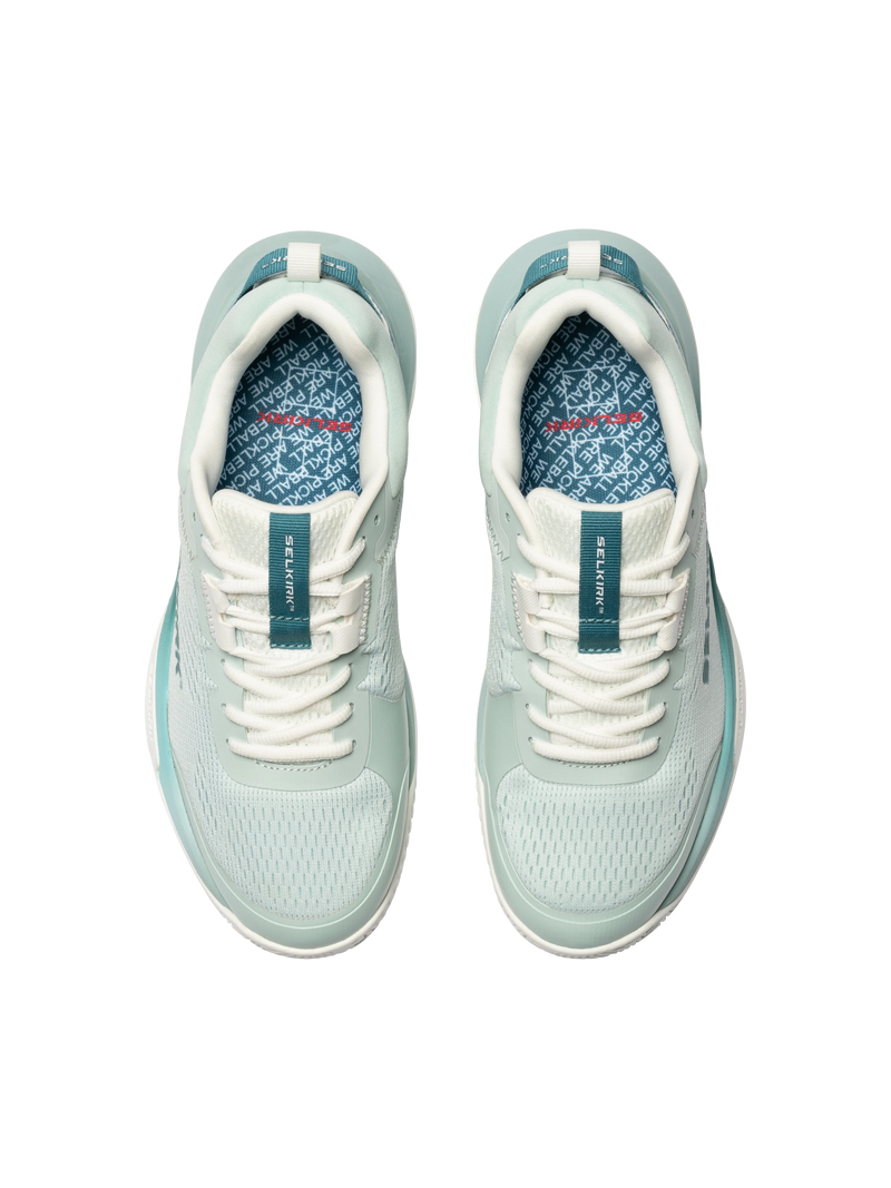Pair of light blue sneakers with white laces on a white background