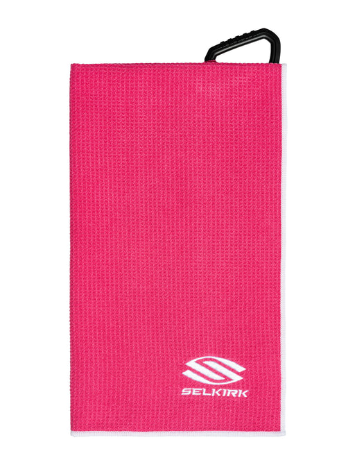 Pink towel with a black handle and Selkirk logo on a white background