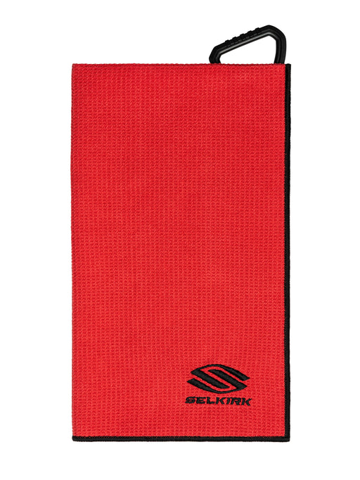 Red towel with black handle and Selkirk logo on a white background