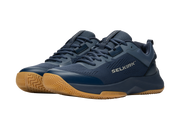 Navy blue athletic shoes with brown soles on a white background