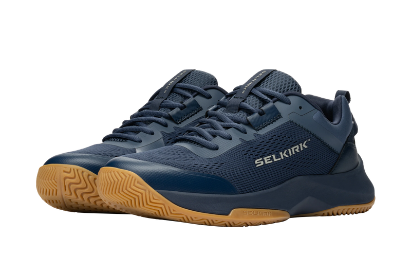 Navy blue athletic shoes with brown soles on a white background
