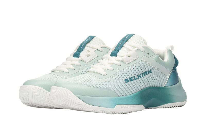 Pair of light blue and white sneakers with 'Selkirk' branding on a white background