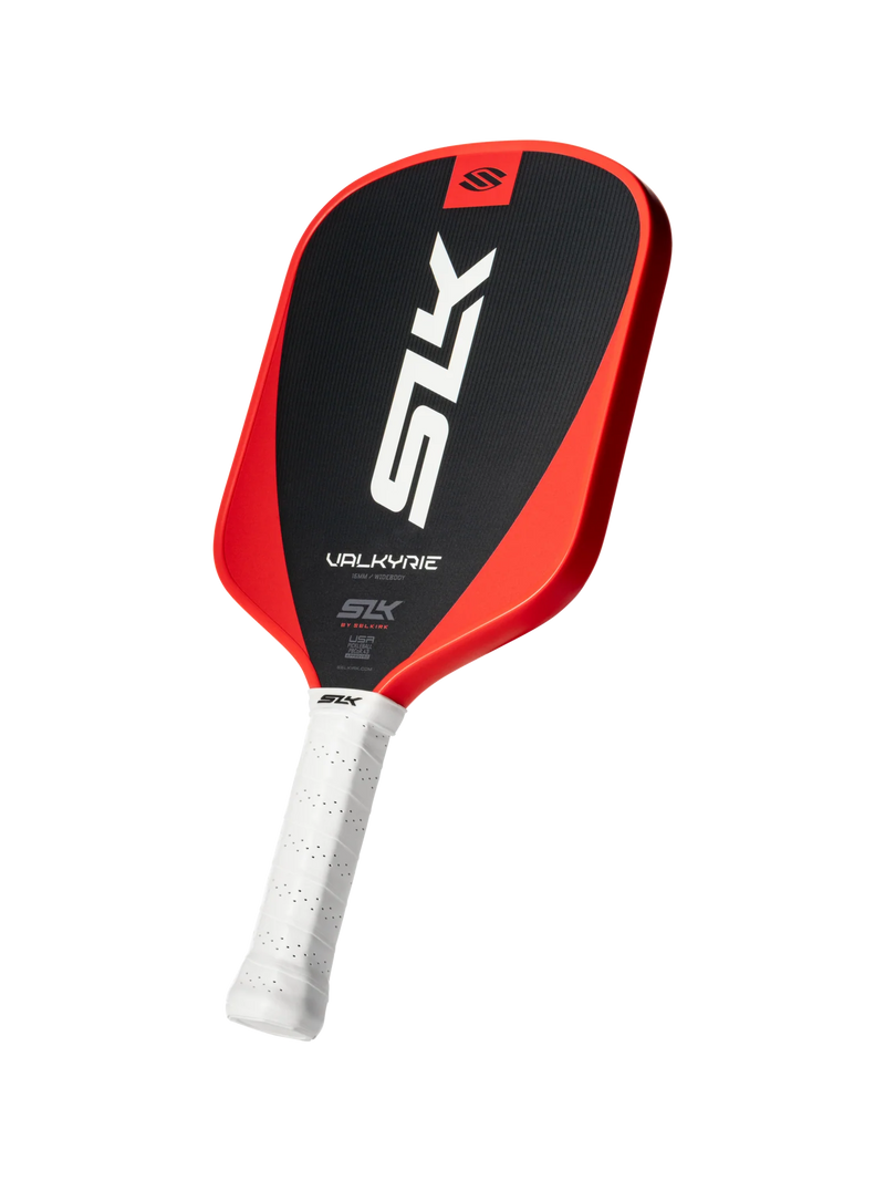 Red and black pickleball paddle with white handle on a white background